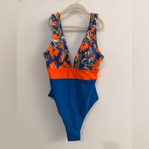 CUPSHE one piece swimsuit- never worn. Size small. Beautiful Royal blue /orange